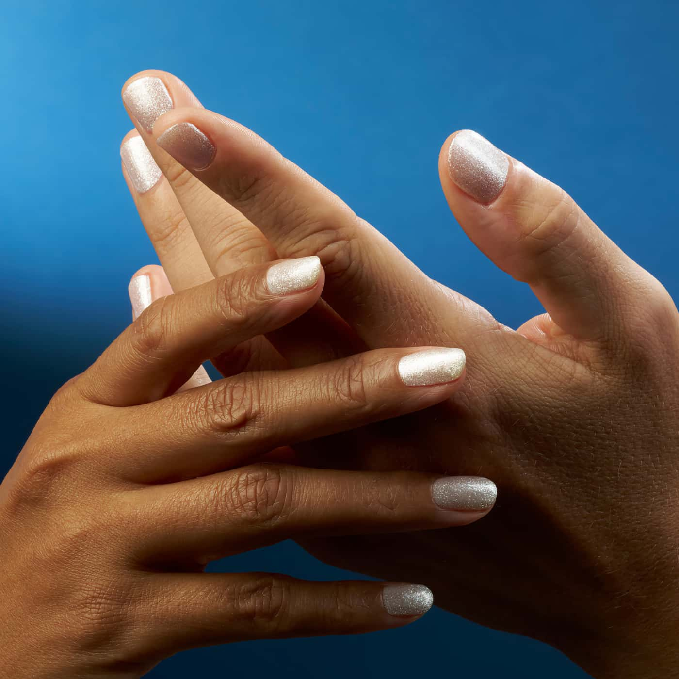 White nail polish with silver sparkles – CND Vinylux No. 479 Winter Warrior – Sophisticated winter look