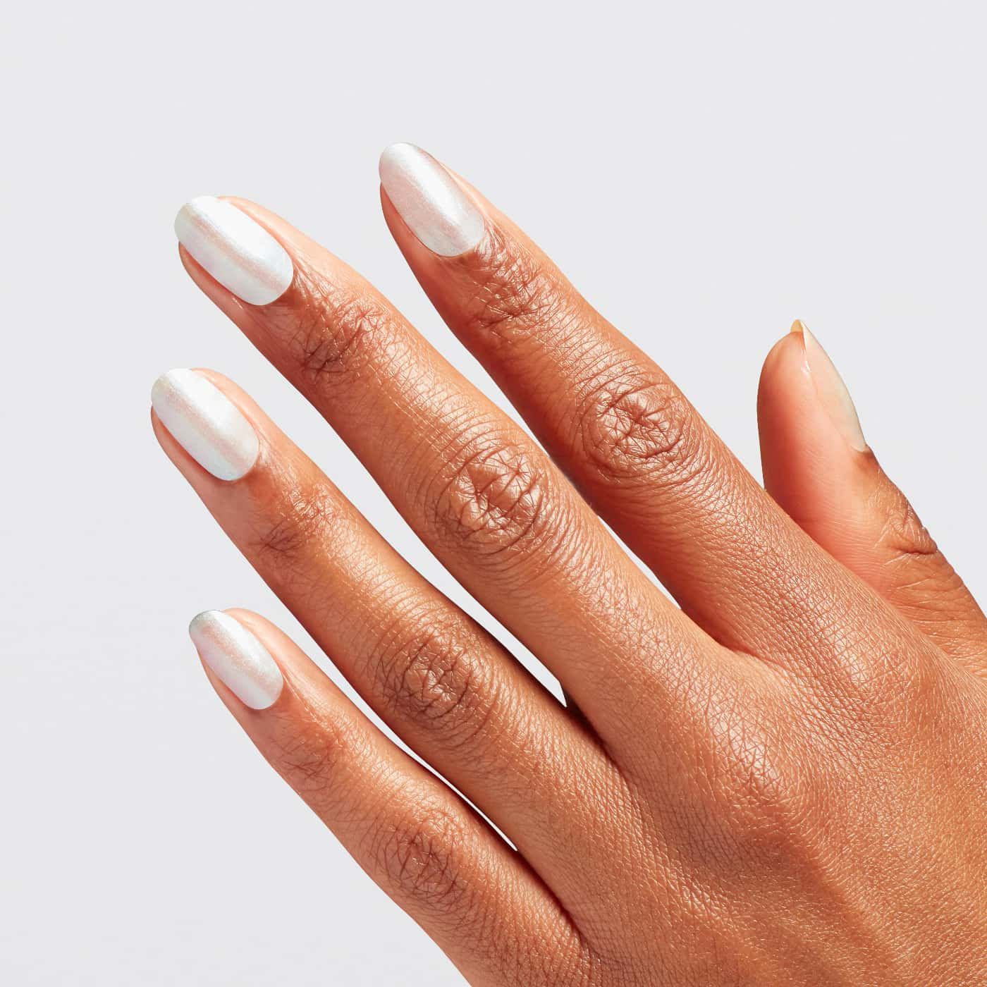 OPI Wicked Oh, For Oz Sake - white pearlescent that reflects pink and green, perfect for a magical and sophisticated manicure