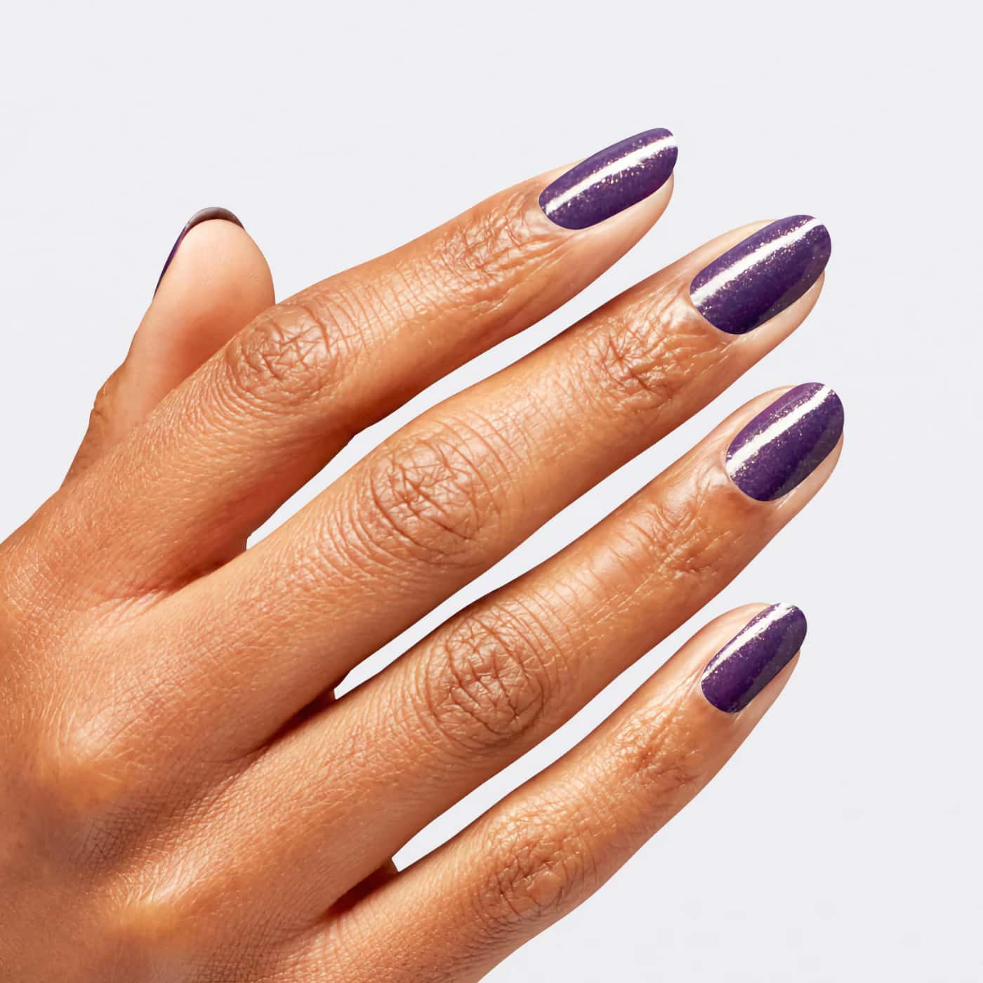 Deep purple nail polish with gold shimmer from OPI Wicked series, perfect for a bold, mysterious, and enchanting look.