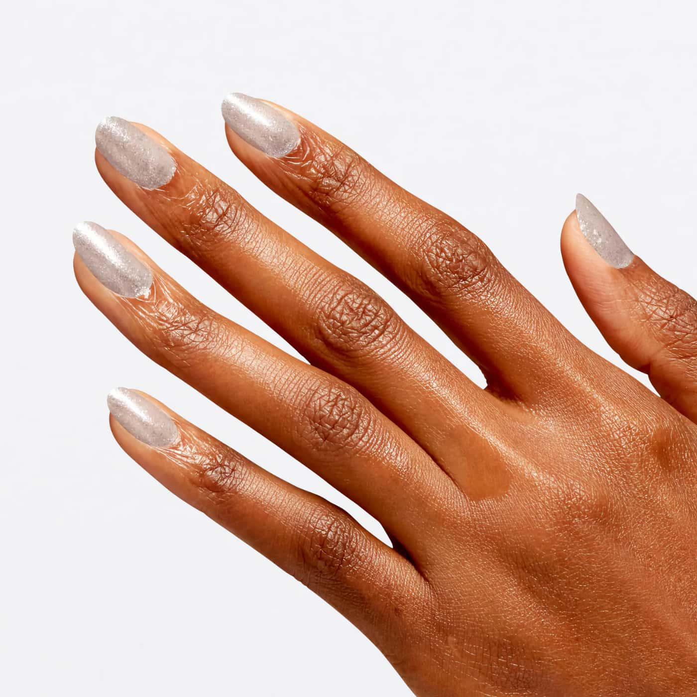 Sheer nail polish with blue, green, and silver glitter from OPI Wicked collection, ideal for a shimmering, magical look.