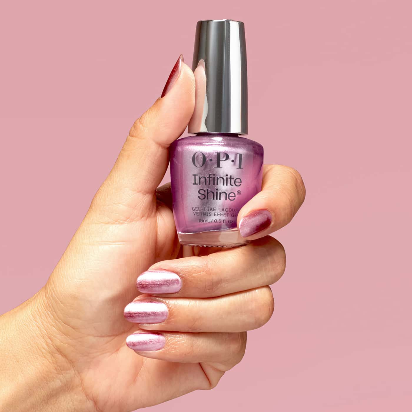 Nail polish in deep purple with icy silver shimmer – OPI Infinite Shine Sheen''s All That, for an elegant nail look.
