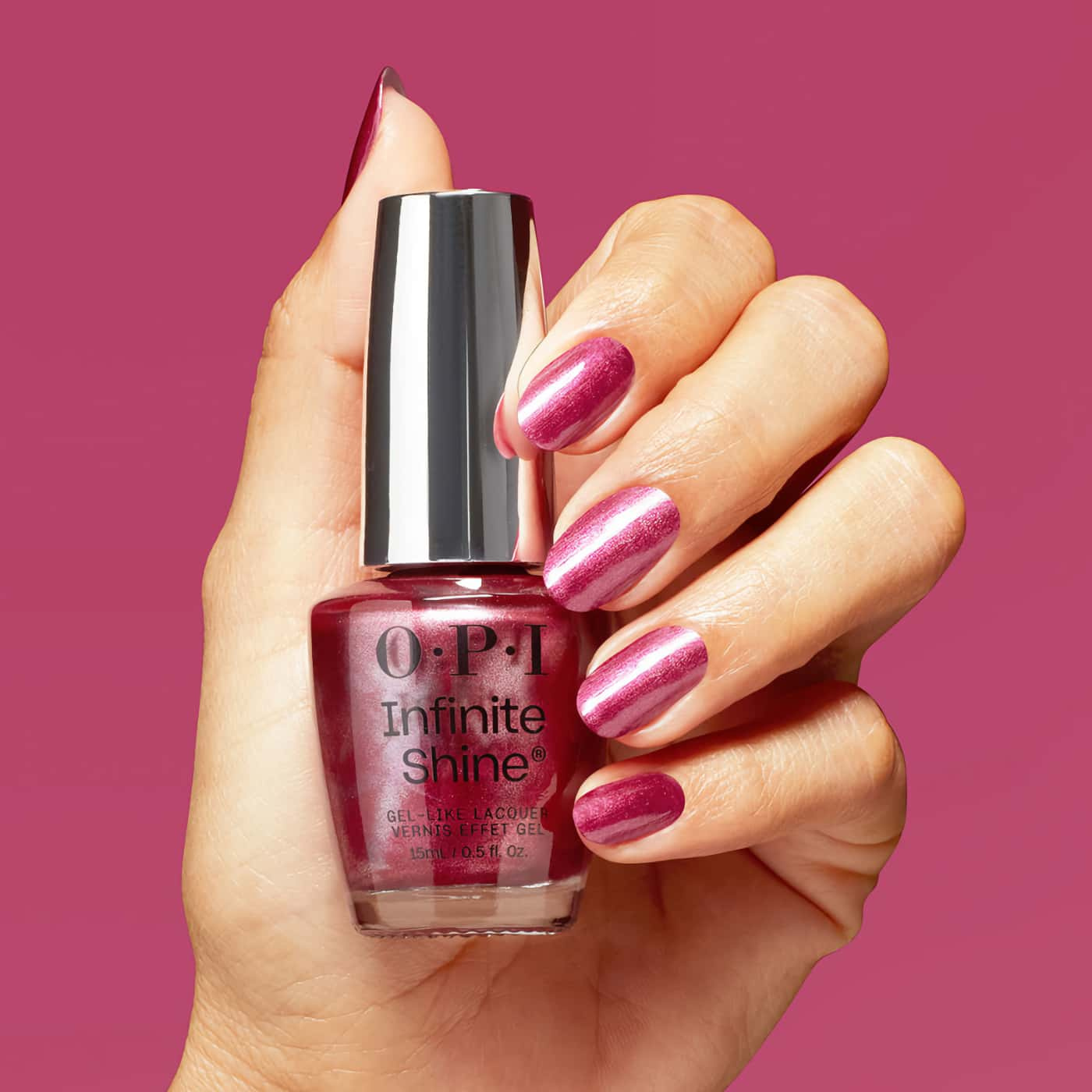 Nail polish in intense magenta shade – OPI Infinite Shine DeJa RoUgE, for a dramatic and elegant look.