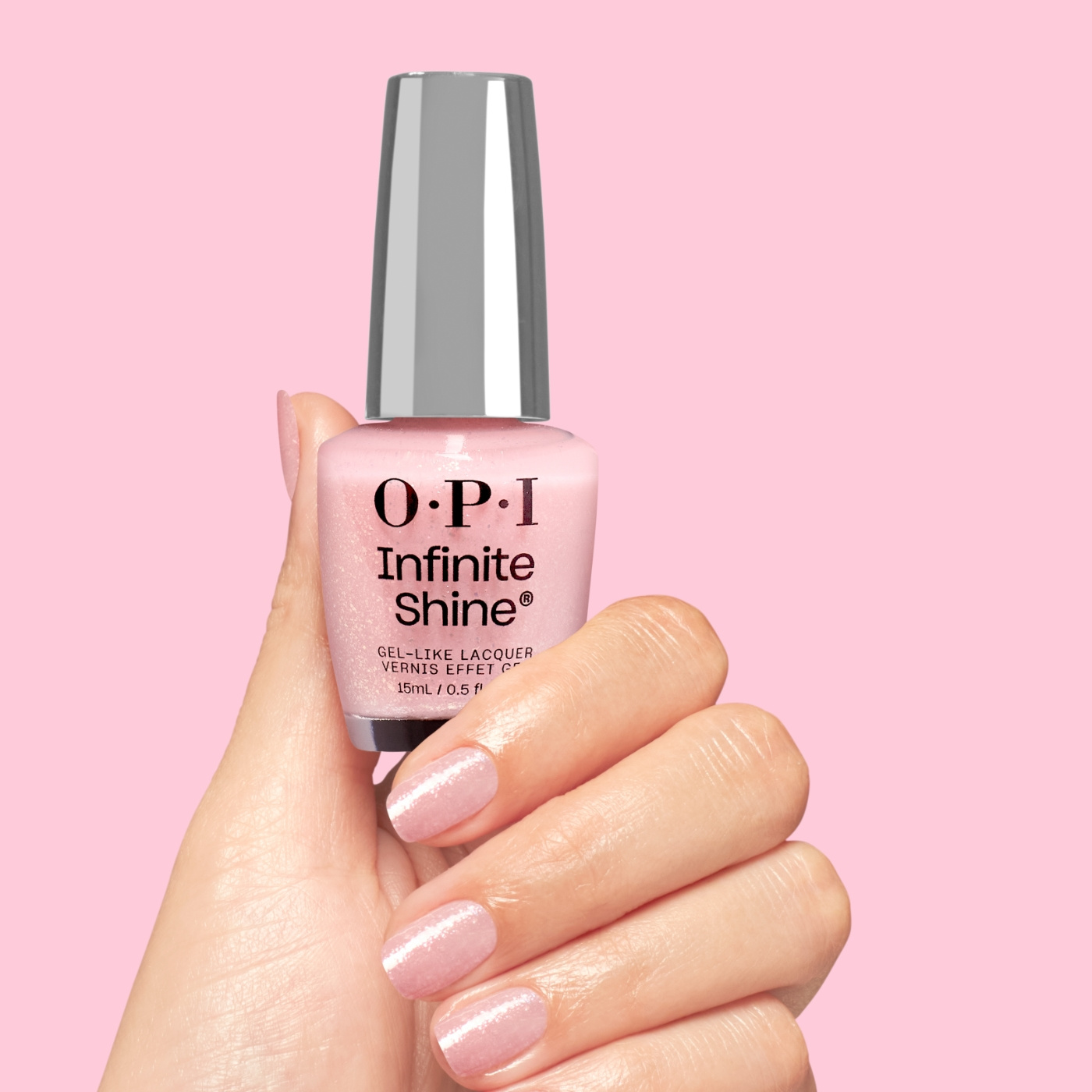 OPI IS Sneak a Pink - Light pink nail polish with subtle glitter for a soft and romantic look