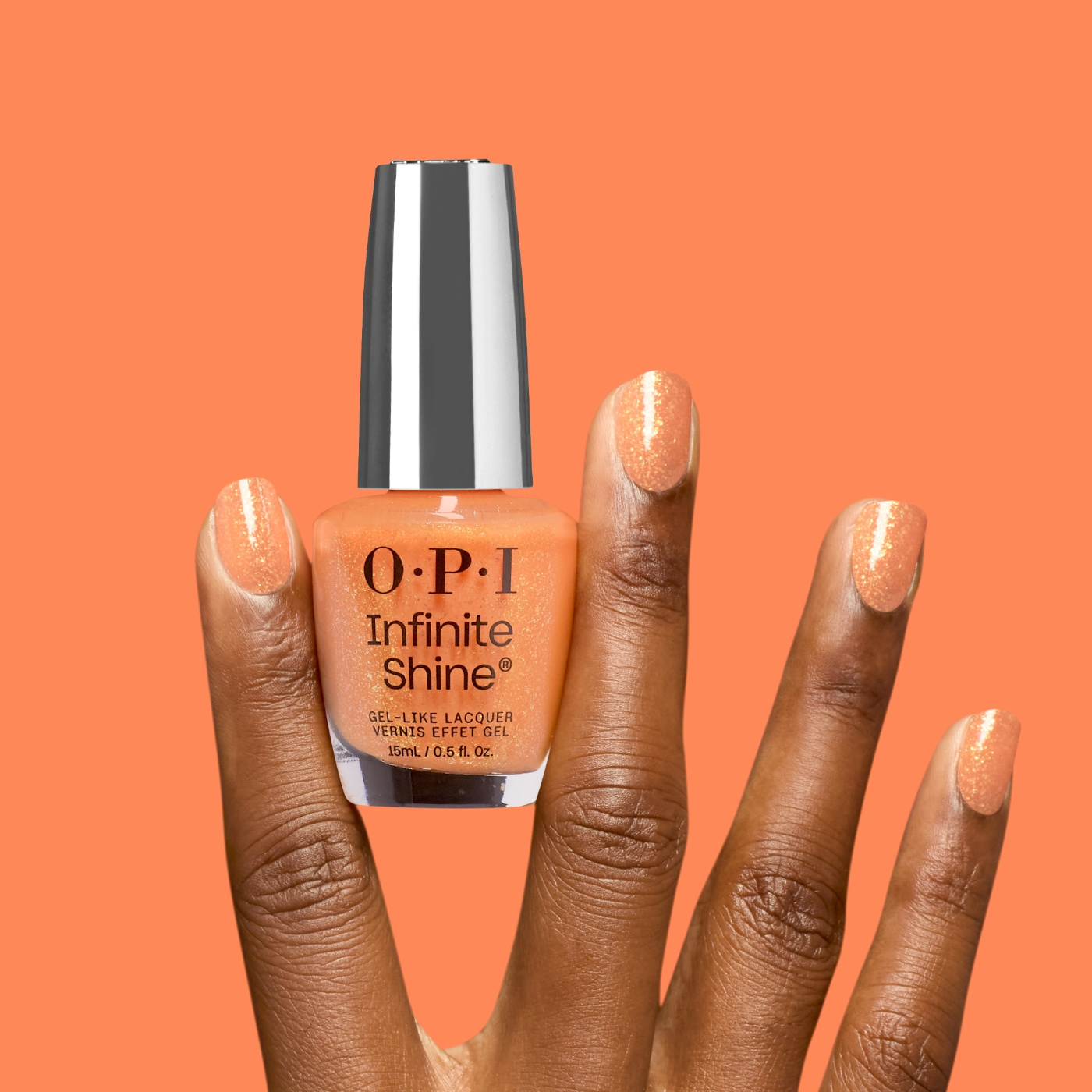 OPI IS Dreamsicle - Orange nail polish with golden glitter for a vibrant and energetic manicure