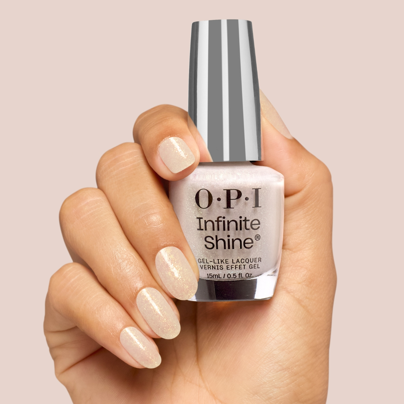 OPI IS From Dusk to Salon - White-gray nail polish with golden shimmer for an elegant and timeless manicure