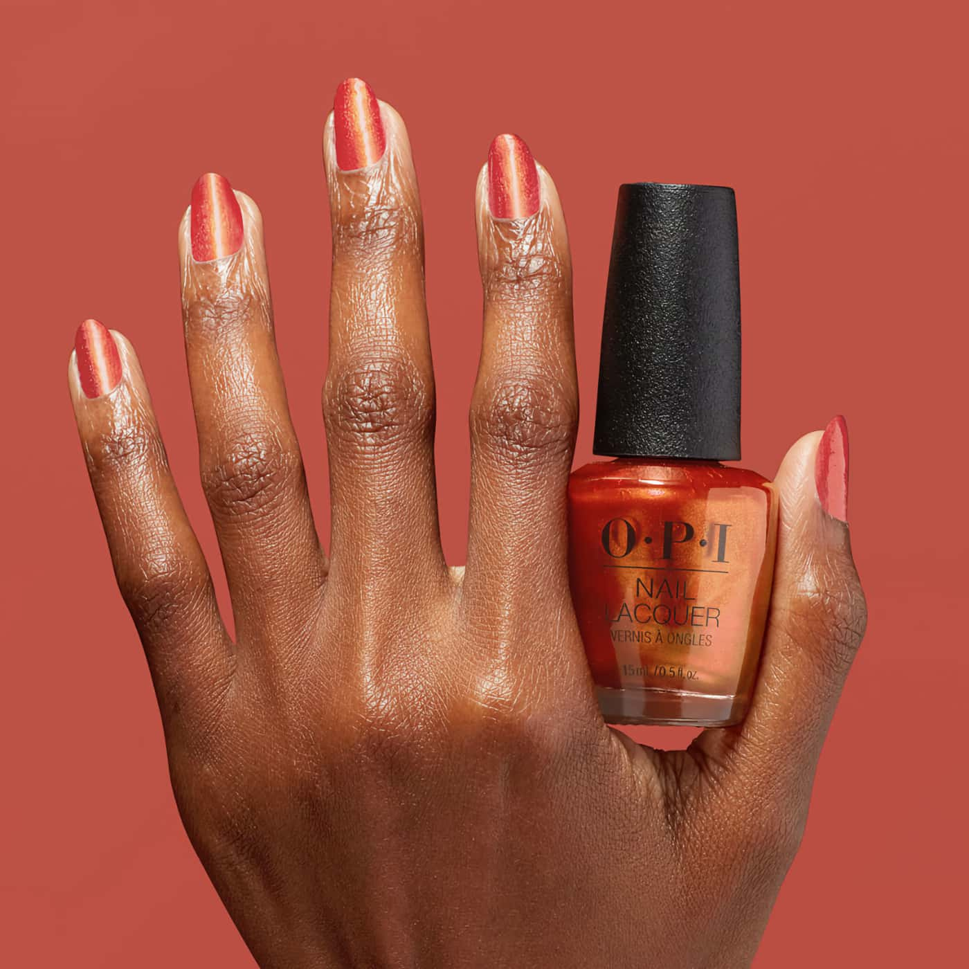 An intense and fiery orange color with a shimmering metallic finish, creates a flame-like effect on nails - OPI Metallic Mega Mix Liquid Fire nail polish
