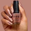 Rose-brown caramel shimmer with a refined retro glow opi most requested route beer float nail polish in caramel rose-brown with bronze pearlescent shimmer and a glossy finish