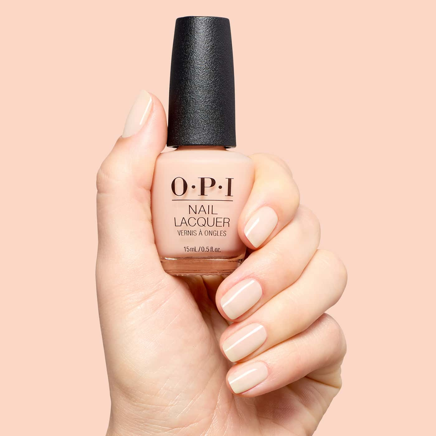 opi most requested throw me a wink nail polish in pale beige nude with a warm undertone and a soft, glossy sheer finish
