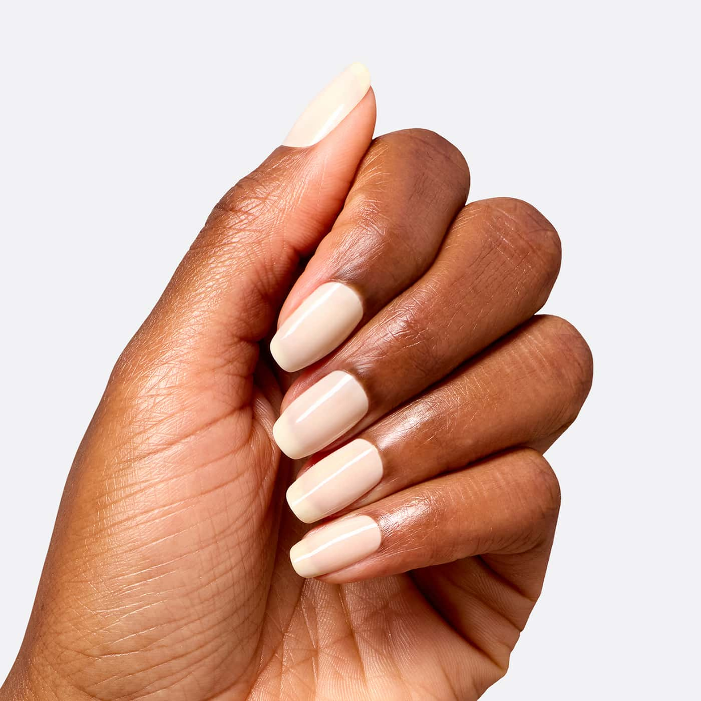 opi most requested throw me a wink nail polish in pale beige nude with a warm undertone and a soft, glossy sheer finish