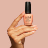 Warm peach orange shade with soft pearlescent shimmer opi queens rule nail polish in a warm peach orange shade with delicate pearlescent shimmer creating a soft luminous and elegant look