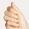 light pastel yellow shade with warm, soft and sunlit character opi opicons sunny bunny nail polish in a light pastel yellow shade with warm undertone and creamy finish, even color with soft appearance